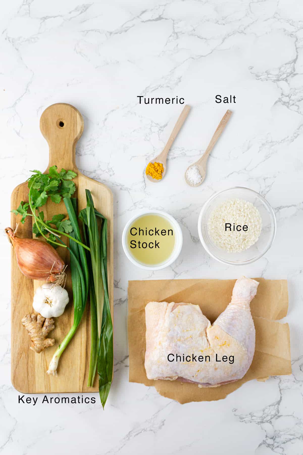 Ingredients for the hainan chicken laid out on a table.