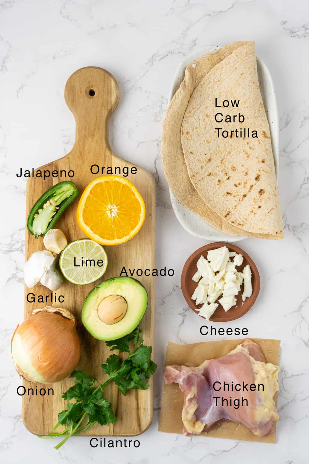 Ingredients for the healthy chicken burrito laid out on the table.