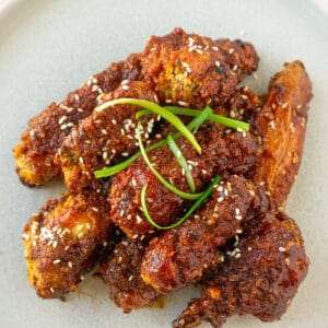 Close up of Korean fried chicken on a plate.