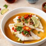 Side shot of 2 Thai steamed fish filets.